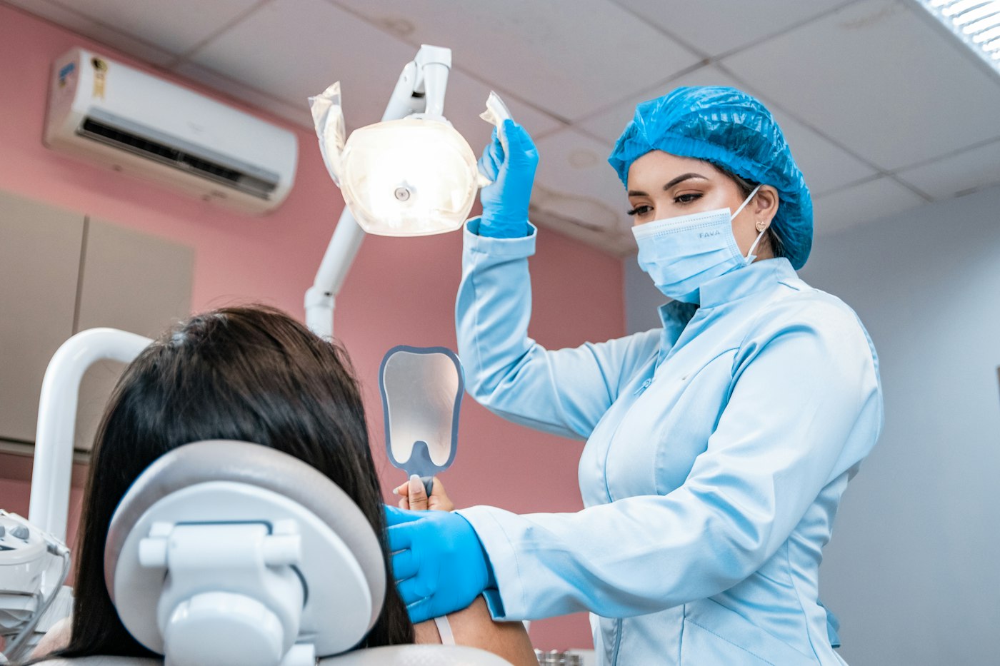 Patient in a dental chair with a dentist